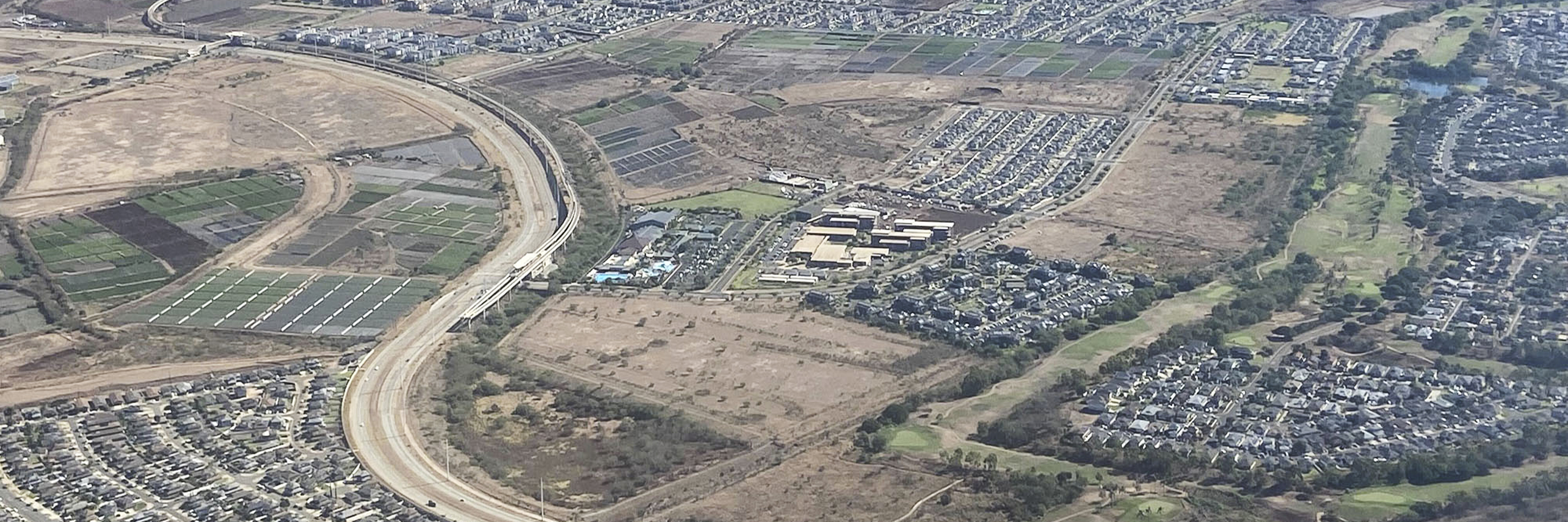 Ewa Villages and Ewa Gentry housing with a current view of the HART rail project along Kualakai Parkway and surrounding housing subdivisions.